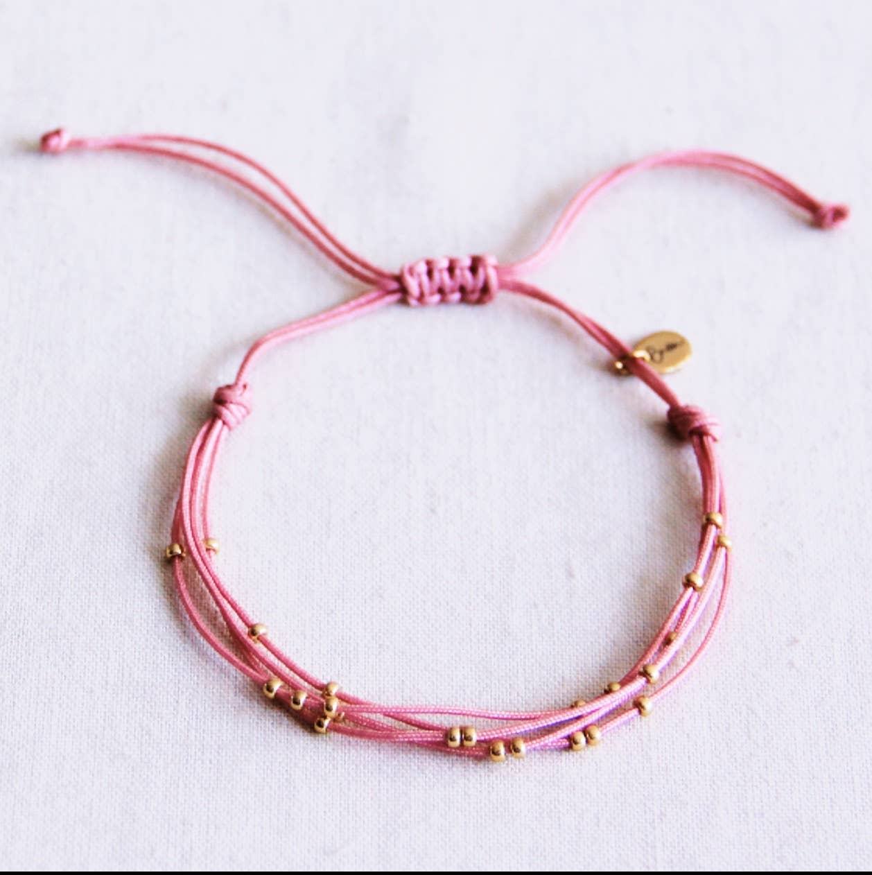 Satinarmband vierfach mit Perlen rosa