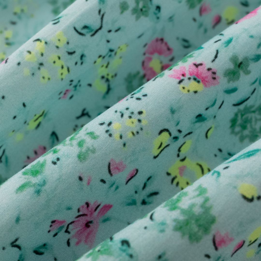 Türkisfarbenes Blumenkleid für Mädchen