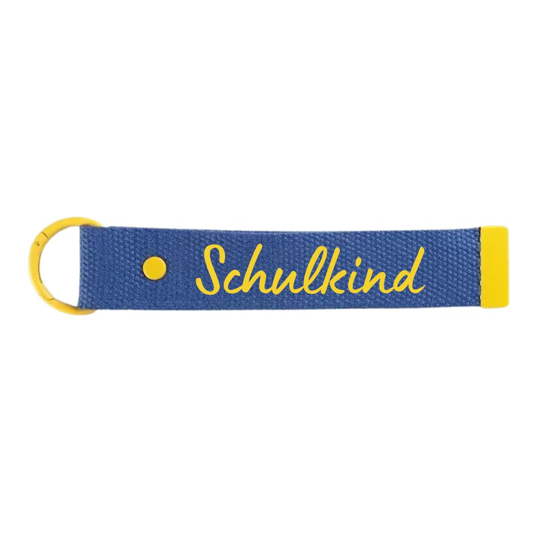 Taschenanhänger mit Schriftzug 'Schulkind' blau/gelb