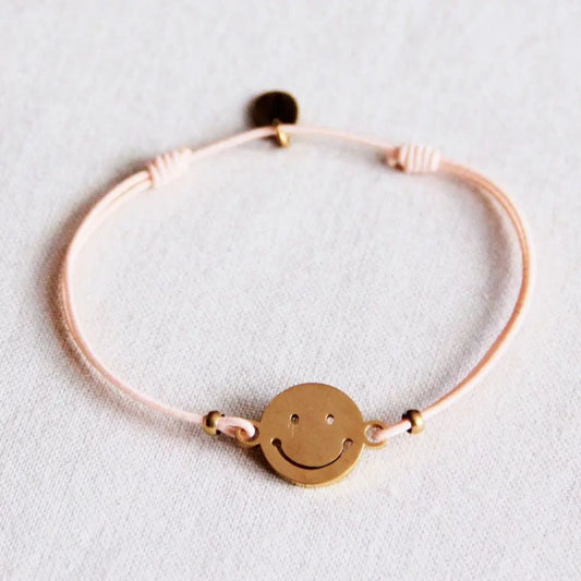 Elastisches Armband mit Smiley pfirsich/gold