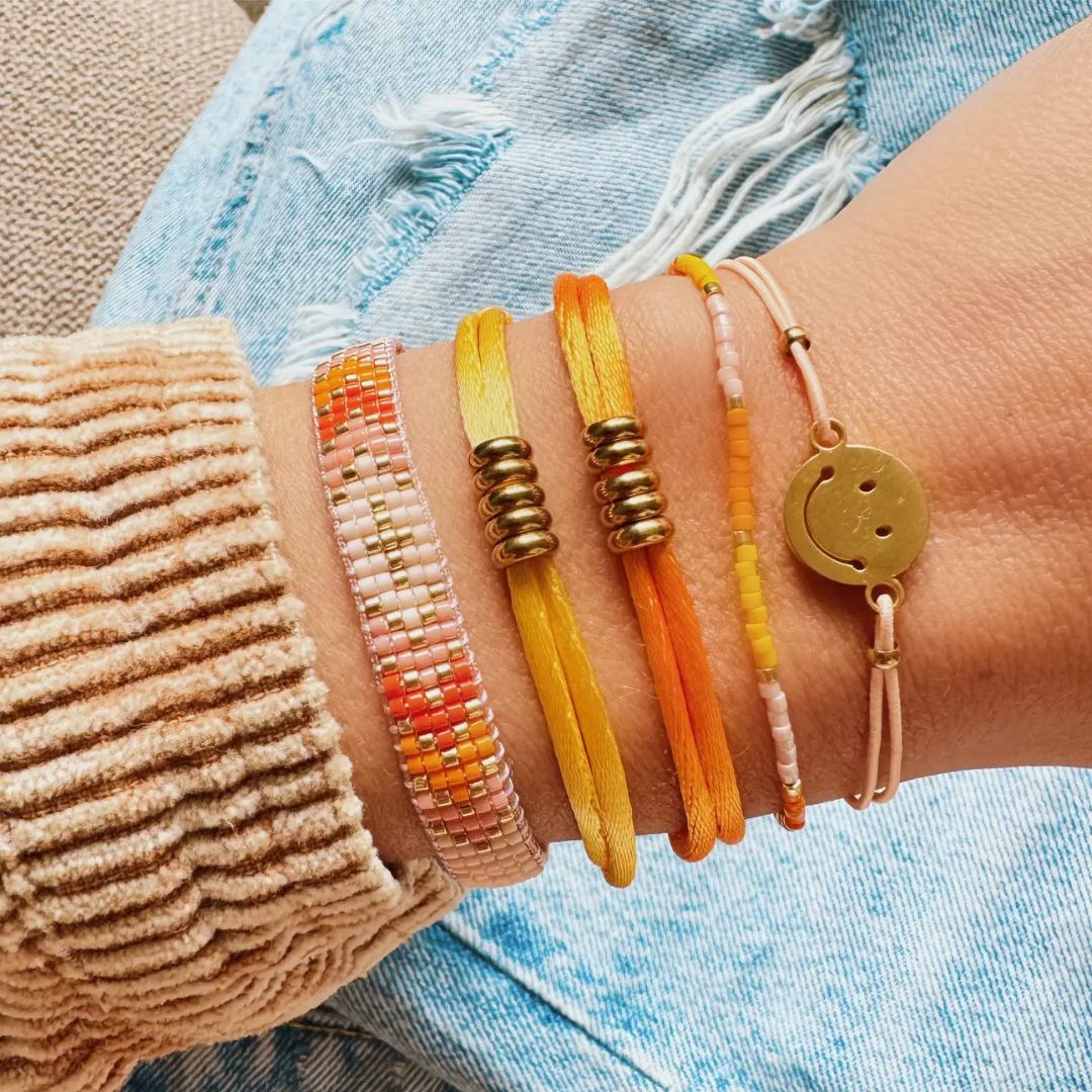 Elastisches Armband mit Smiley pfirsich/gold