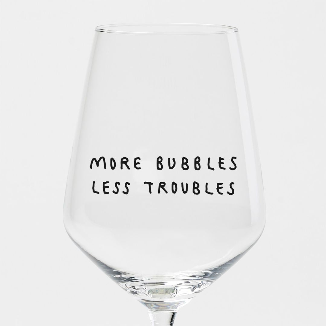 Weinglas 'More Bubbles Less Troubles'