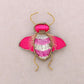 Charakterbrosche 'Insektenbrosche mit Pailletten' fuchsia