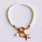 Perlenarmband mit Seestern, Muschel und Perle