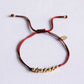 Satinarmband mit goldfarbenen Perlen bordeaux/gold