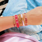 Satinarmband mit goldfarbenen Perlen bordeaux/gold