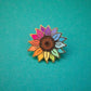 Anstecknadel mit Sonnenblume in Regenbogenfarben