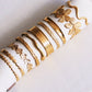 Armreif breit ausgestellter, goldfarbener Armreif