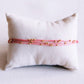Satinarmband vierfach mit Perlen rosa