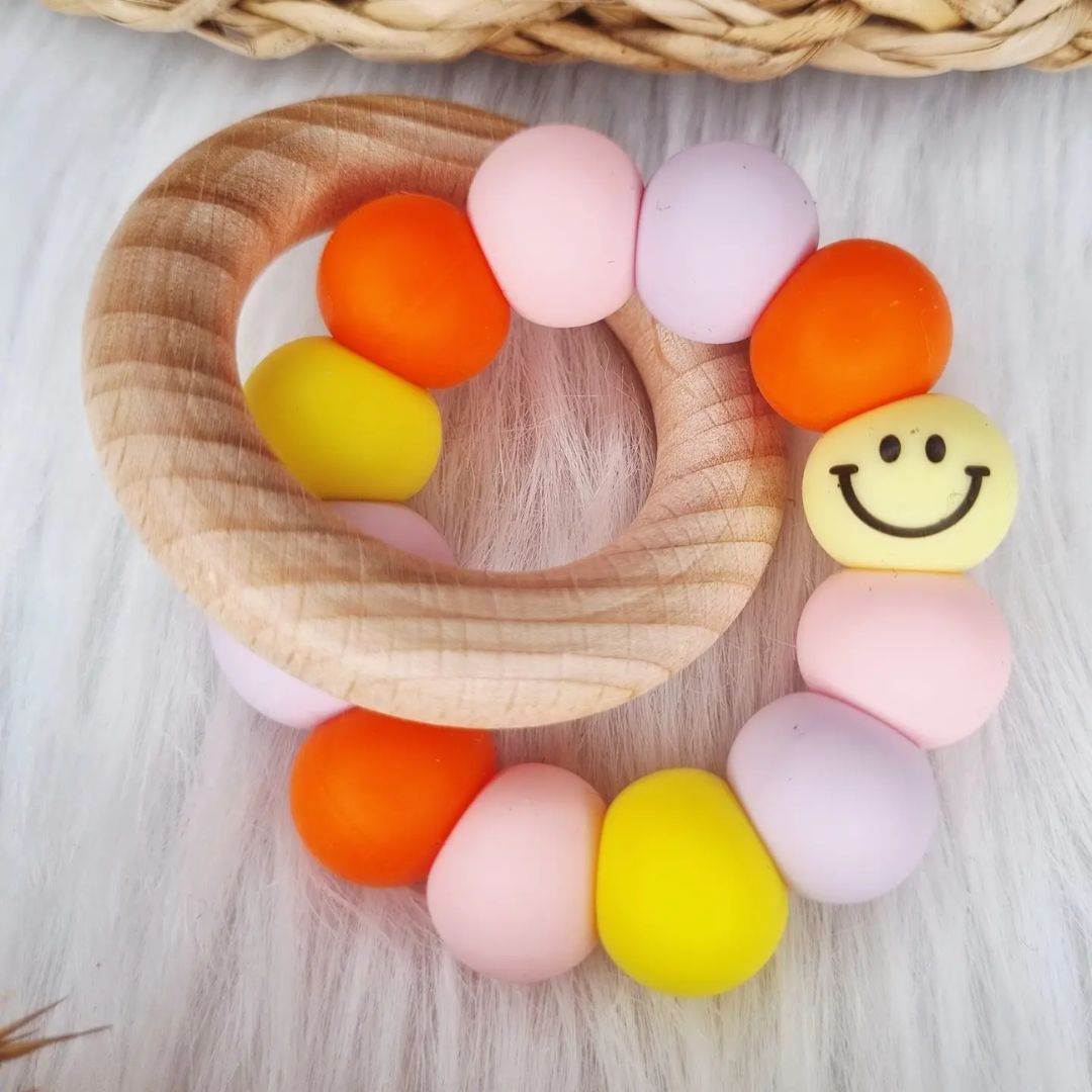 Beißring 'Smiley' pastell/orange