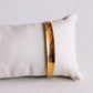 Armreif breit ausgestellter, goldfarbener Armreif