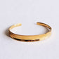 Armreif breit ausgestellter, goldfarbener Armreif