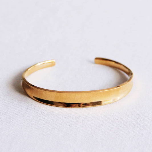 Armreif breit ausgestellter, goldfarbener Armreif