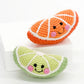 Handgemachte Baby Rassel 'Zesty Lime Slice'