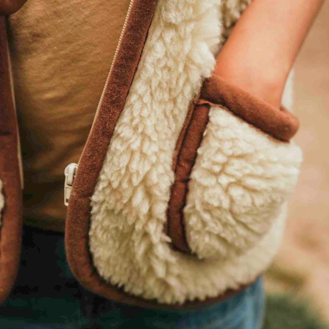 Kinder Weste aus Merinowolle mit Kapuze beige