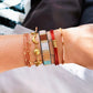 Satinarmband vierfach mit Perlen cognac