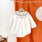 Baby Body aus Cord mit besticktem Kragen weiß